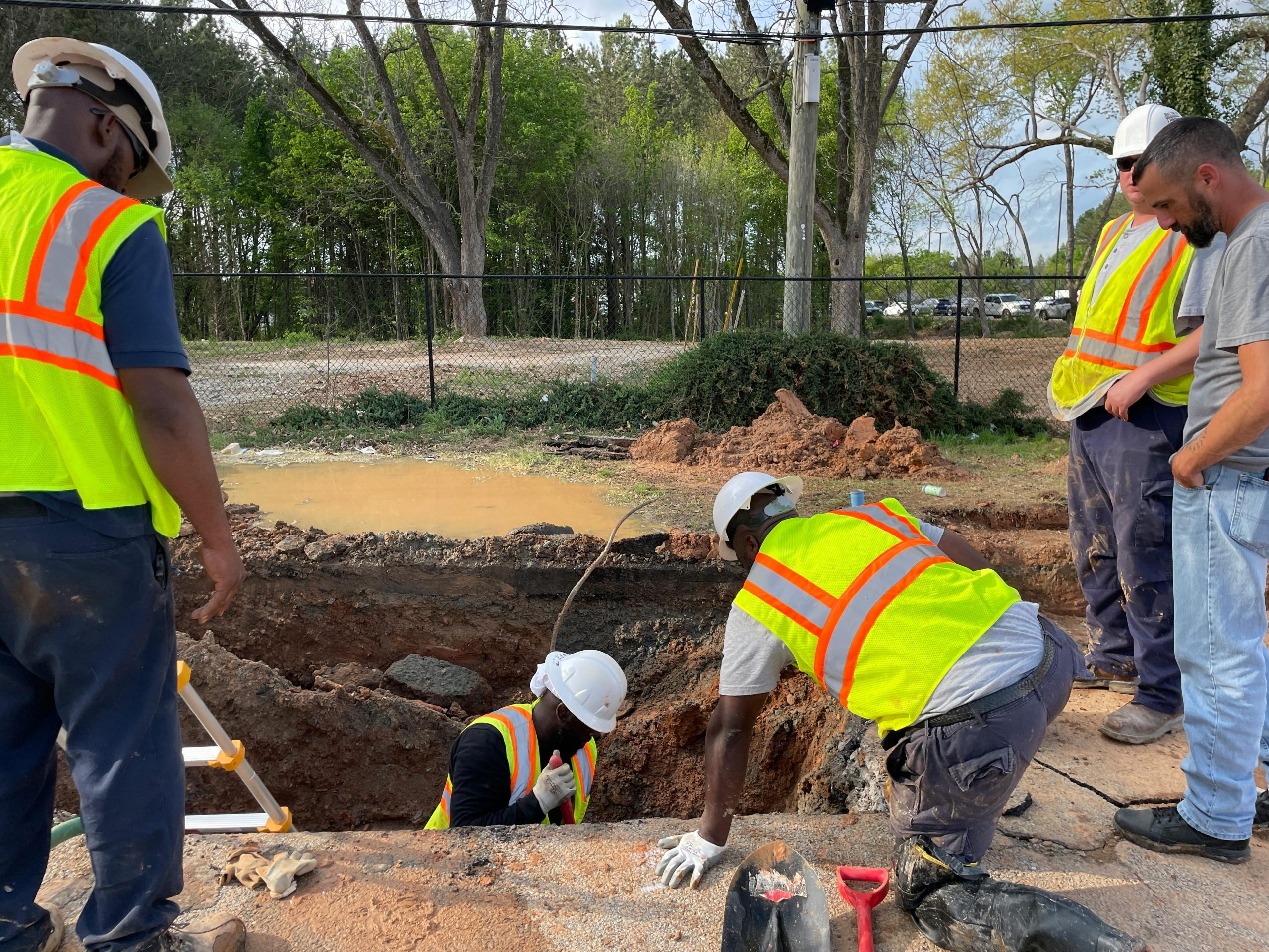 Excavation crew working in a utility trench