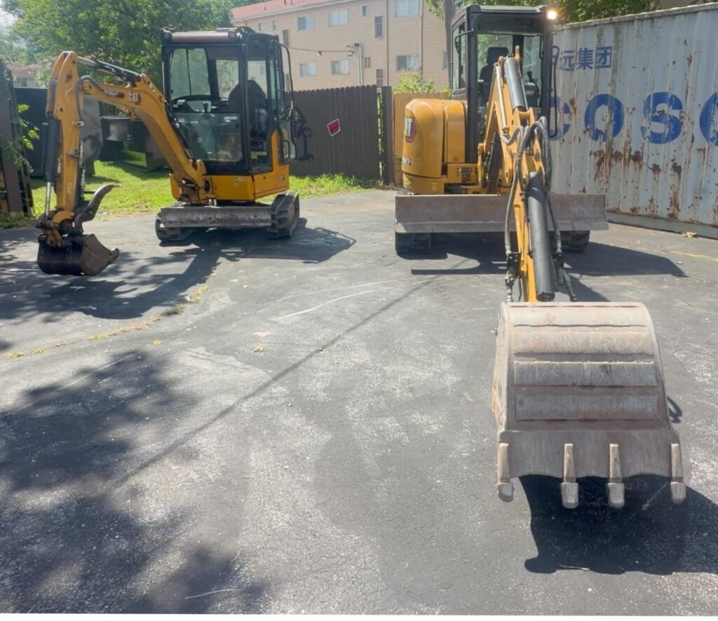 Two CAT mini excavators from the Diamond Dumpsters & Dirtworks fleet