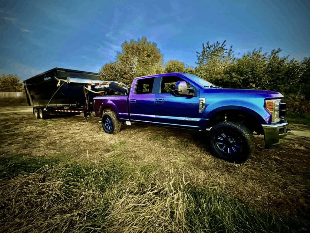 Diamond Dumpsters & Dirtworks truck with roll-off dumpster