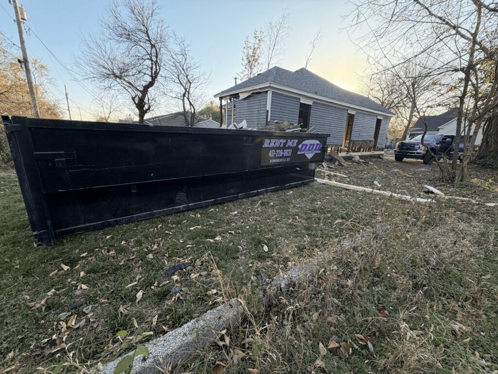 Diamond Dumpsters roll-off dumpster on a job site