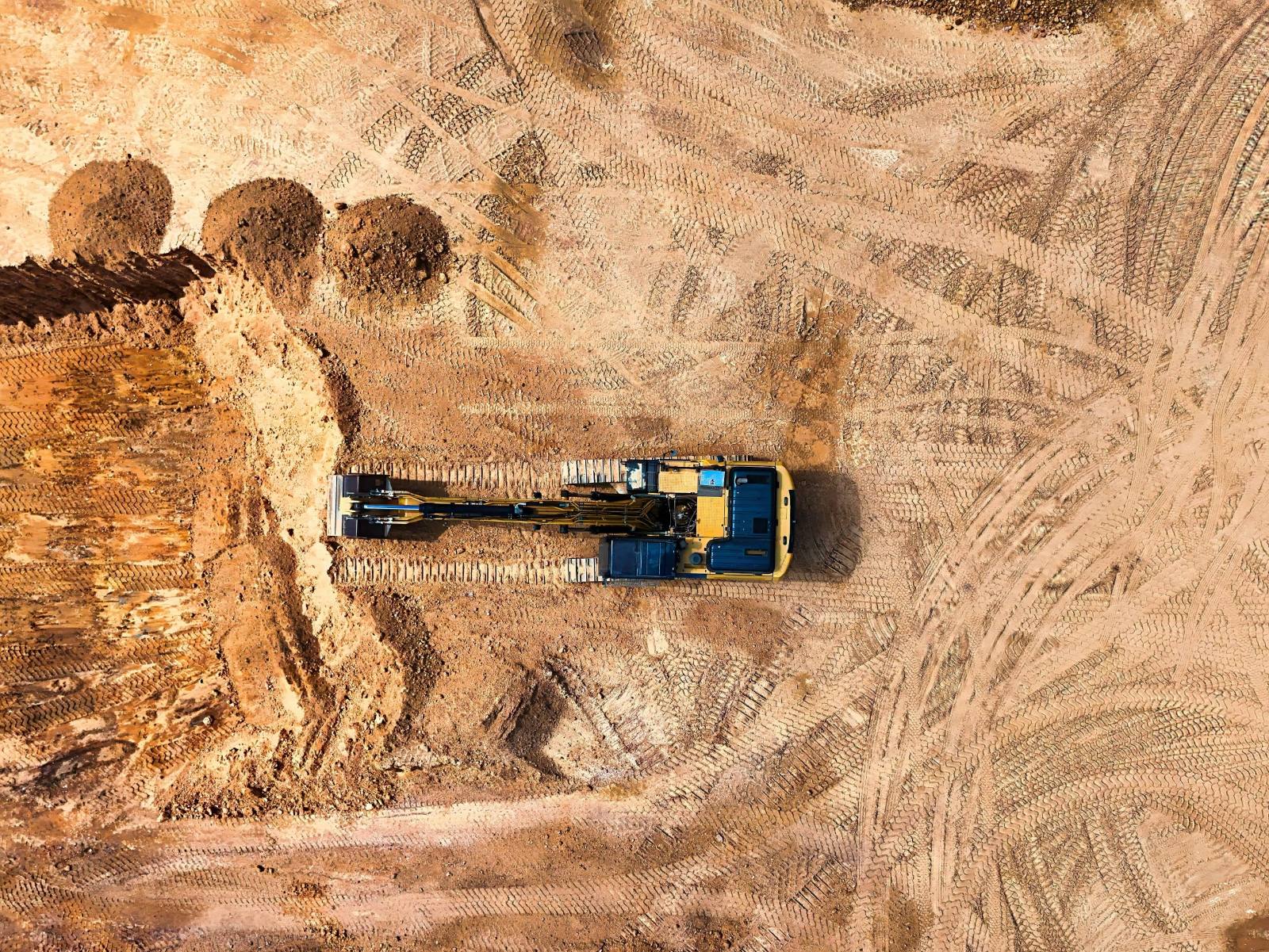 Excavator grading a job site