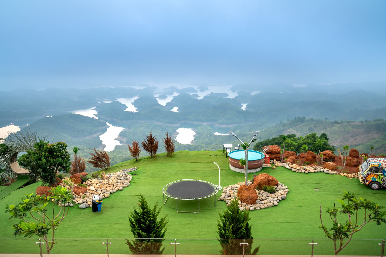 In-ground trampoline set level with a landscaped backyard